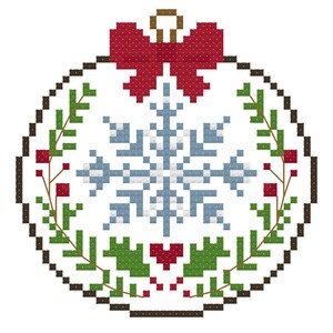 May include: A cross-stitch pattern of a circular Christmas ornament featuring a central light blue and white snowflake, a red bow at the top, and green pine branches with red berries framing the bottom and sides, all outlined in dark brown.