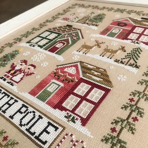 Country Cottage Needleworks GREETINGS From The NORTH POLE  - Christmas Cross Stitch