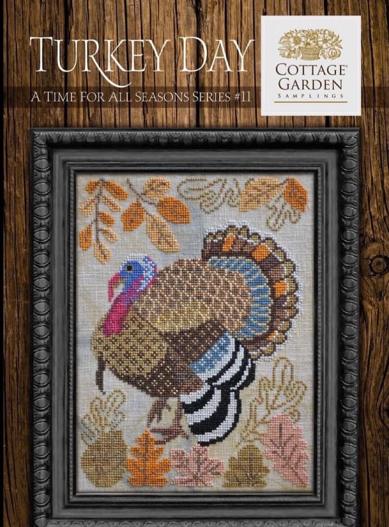May include: A cross-stitch pattern featuring a turkey surrounded by autumn leaves. The pattern is titled "Turkey Day" and is part of the "A Time for All Seasons Series #11" by Cottage Garden Samplings.