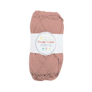 May include: A skein of dusty rose colored chunky yarn, made of 100% cotton. The label reads "Chunky Thread by Lori Holt of Bee in my Bonnet".
