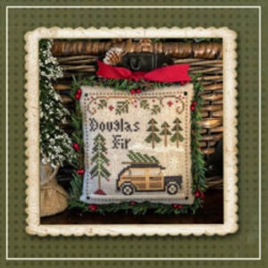 May include: A white cross-stitch pillow with a red ribbon and a green wreath border. The pillow features a vintage car with a Christmas tree on top and the text "Douglas Fir".