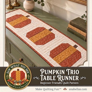 May include: A rectangular quilted table runner featuring three pumpkin motifs in shades of orange, yellow, and brown on a cream background. The text reads: Sew What You See, Pumpkin Trio Table Runner, Beginner Friendly Quilt Pattern, Make Quilting Fun, anabellas.com.