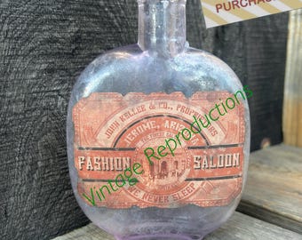 Jerome Arizona Old West 1880s-era round whiskey flask with REPRODUCTION saloon label