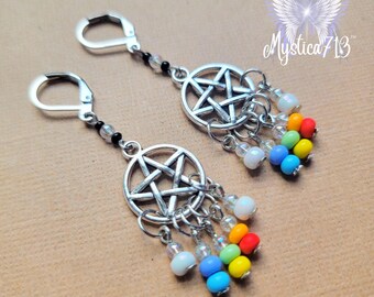 May include: A pair of silver earrings with a pentagram charm and rainbow coloured beads hanging from each charm.