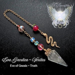 May include: A gold-colored pendulum with a clear crystal point, adorned with colorful beads, a golden snake charm, and a red apple charm. The text "Eva Gnostica ~ Veritas" and "Eve of Gnosis ~ Truth" are displayed.