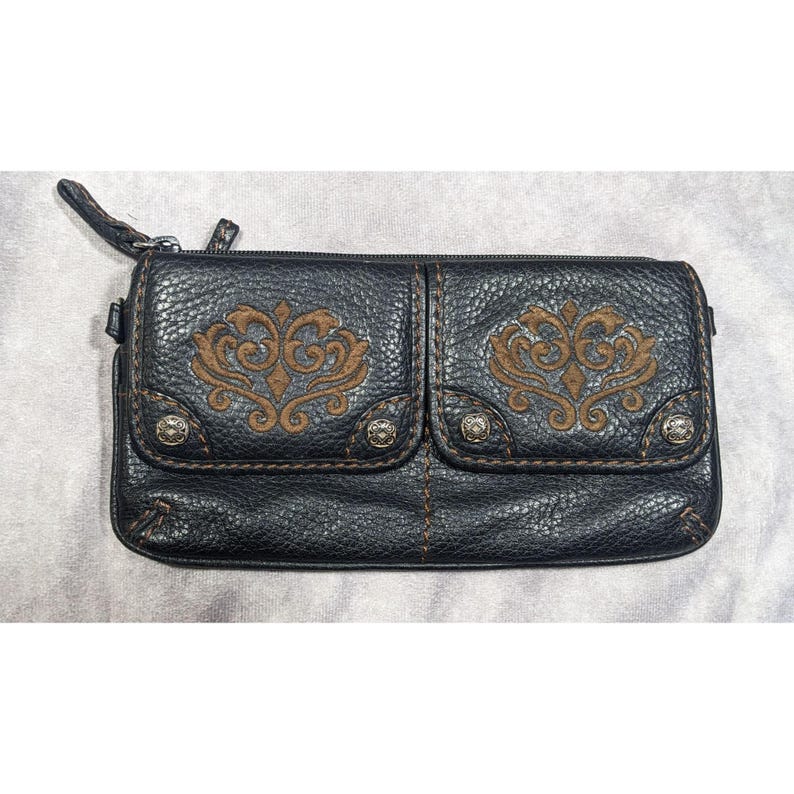 May include: Black leather wallet with two front pockets and brown embroidered floral designs. The wallet has a zipper closure and silver studs.