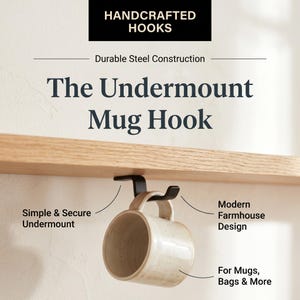 May include: Black undermount mug hook made of durable steel. The hook is designed with a modern farmhouse style and is suitable for mugs, bags, and more. The image includes the text "Handcrafted Hooks".