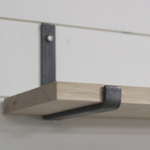 Raw metal floating shelf bracket