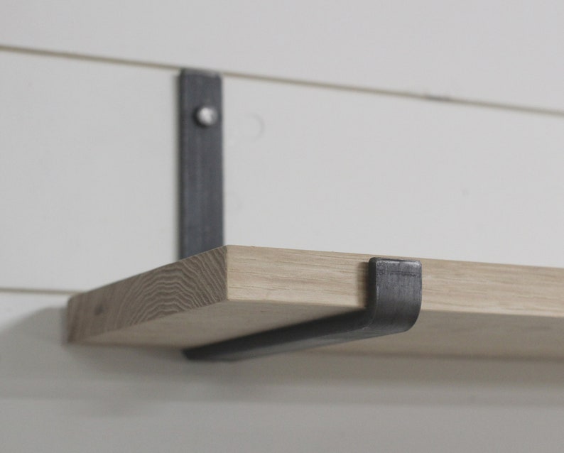 Raw metal floating shelf bracket