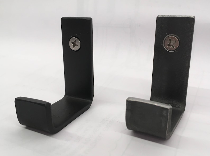 Heavy duty metal wall hook available in black powder coat and raw clear coated steel.  Great for use in kitchen bath mudrooms and garages as towel bag gear and coat hooks.