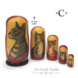 Russian Blue cat hand painted on a wooden Russian nesting doll, collectible Matryoshka set of 5 featuring realistic cat portraits on a white background