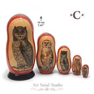 Model C: Five Russian nesting dolls featuring hand-painted owls in different shapes and natural brown, beige, and gray tones, including a prominent horned owl with ear tufts on the largest doll. The 19 cm Matryoshka set is arranged from largest to smallest on a clean white background