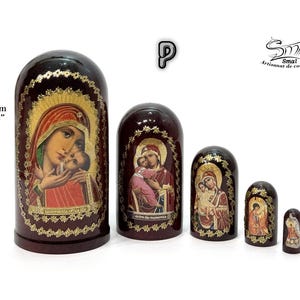 May include: A set of five Russian nesting dolls, each with a dark brown finish and religious iconography. The largest doll is 4.33 inches (11 cm) tall. The dolls feature images of the Virgin Mary and child, with gold accents.