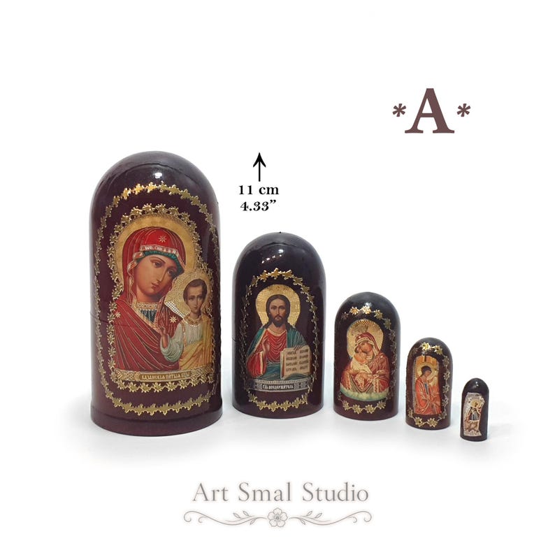 Russian Orthodox icon Matryoshka nesting dolls featuring the Kazan Mother of God on the largest doll, Jesus Christ on the second, the Virgin of Tenderness (Eleusa) with the Christ Child on the third, the Annunciation on the fourth, and the Guardian Angel on the smallest doll. Hand-painted set of 5 wooden Russian nesting dolls, 11 cm (4.33") collectible religious artwork.