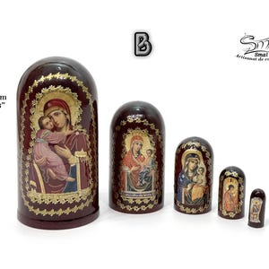 May include: A set of five nesting dolls, each with a dark red finish and gold accents. The dolls feature religious iconography, with images of the Virgin Mary and child. The largest doll is 4.33 inches (11 cm) tall.
