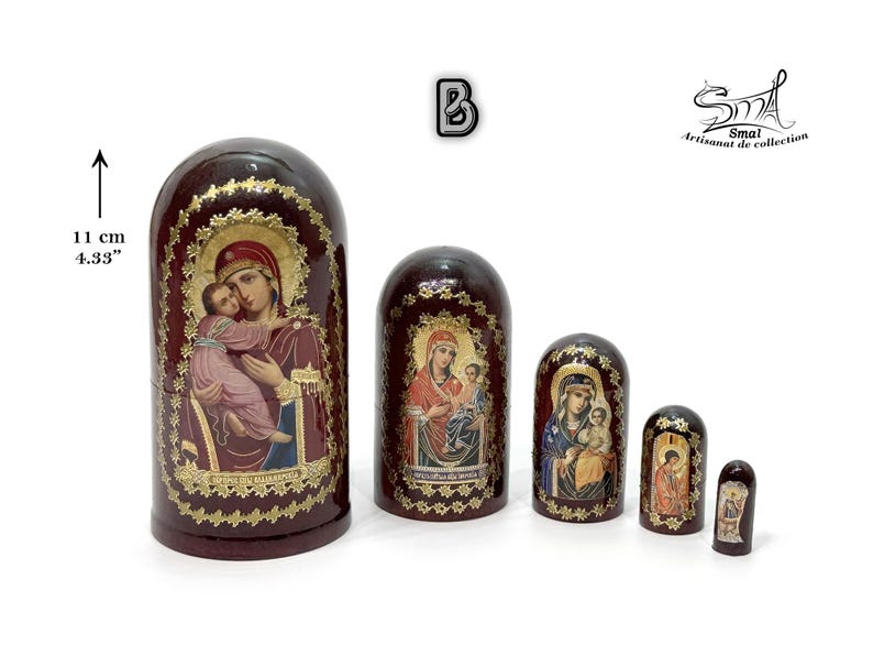 May include: A set of five nesting dolls, each with a dark red finish and gold accents. The dolls feature religious iconography, with images of the Virgin Mary and child. The largest doll is 4.33 inches (11 cm) tall.