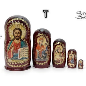 May include: A set of five Russian nesting dolls, each with a burgundy finish and gold accents. The largest doll is 4.13 inches tall and features an image of Jesus. The other dolls depict religious figures.