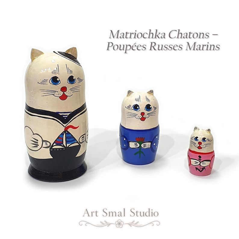 Set of 3 hand-painted cat sailor matryoshka dolls, 11 cm tall, displayed on a white background: a white and black sailor cat, a white and blue cat, and a white and pink cat