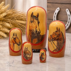 Horse matryoshka dolls set of five, hand painted Russian nesting dolls with detailed horse portraits, wooden folk art, red accents, and rustic equestrian decor
