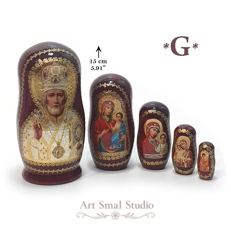 A five-piece religious nesting doll set, with the largest doll, 11 cm (4.33 inches) tall, featuring an icon of Saint Nicholas. The four smaller dolls are each adorned with different Orthodox icons