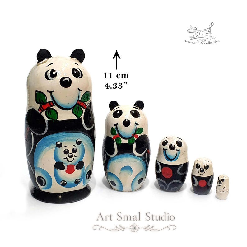 5-piece panda matryoshka nesting doll set, handmade Russian wooden dolls in graduated sizes. The largest panda nesting doll measures 11 cm (4.33 inches), with smaller dolls arranged beside it on a white background