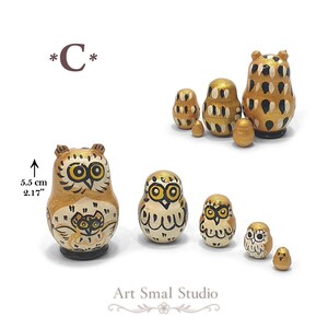 Golden owl nesting dolls arranged as a five-piece Russian matryoshka set, showing the graduated figures and their tiny inner dolls alongside a 5.5 cm size reference; model C in golden color