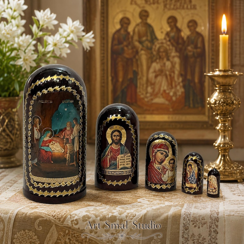 Hand-painted Russian Orthodox Nativity nesting doll set of 5 featuring the Birth of Christ icon, glossy wooden Matryoshka dolls displayed on a decorative table with candles and religious icons.