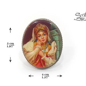 Russian folk art brooch – miniature painting of a traditional woman in costume, handcrafted on real mother-of-pearl.