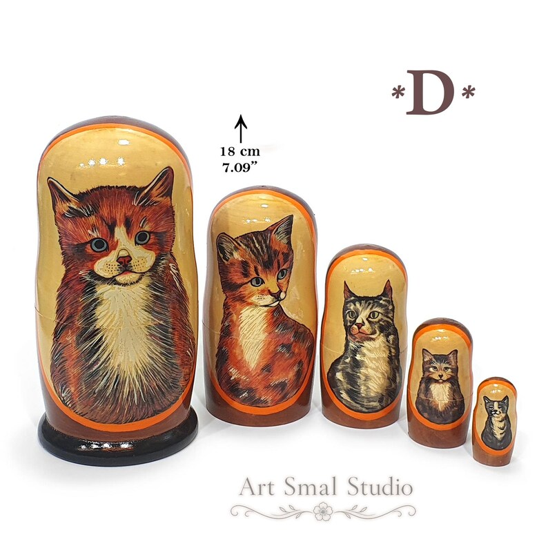 Maine Coon cat hand painted on a wooden Russian nesting doll, collectible Matryoshka set of 5 featuring realistic cat portraits on a white background with size reference