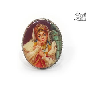 Hand-painted brooch of a Russian woman in traditional costume – lacquer miniature on mother of pearl, collectible folk art jewelry.