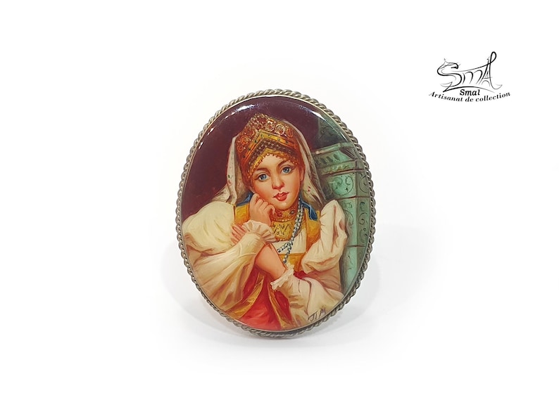 Hand-painted brooch of a Russian woman in traditional costume – lacquer miniature on mother of pearl, collectible folk art jewelry.