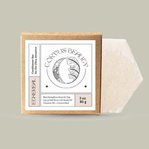 May include: A brown cardboard box and a white hexagonal bar of soap. The box has a white label with the text "CORPUS BEAUTY" and "ETHEREAL". The label also lists ingredients and the weight: 3 oz (85 g).
