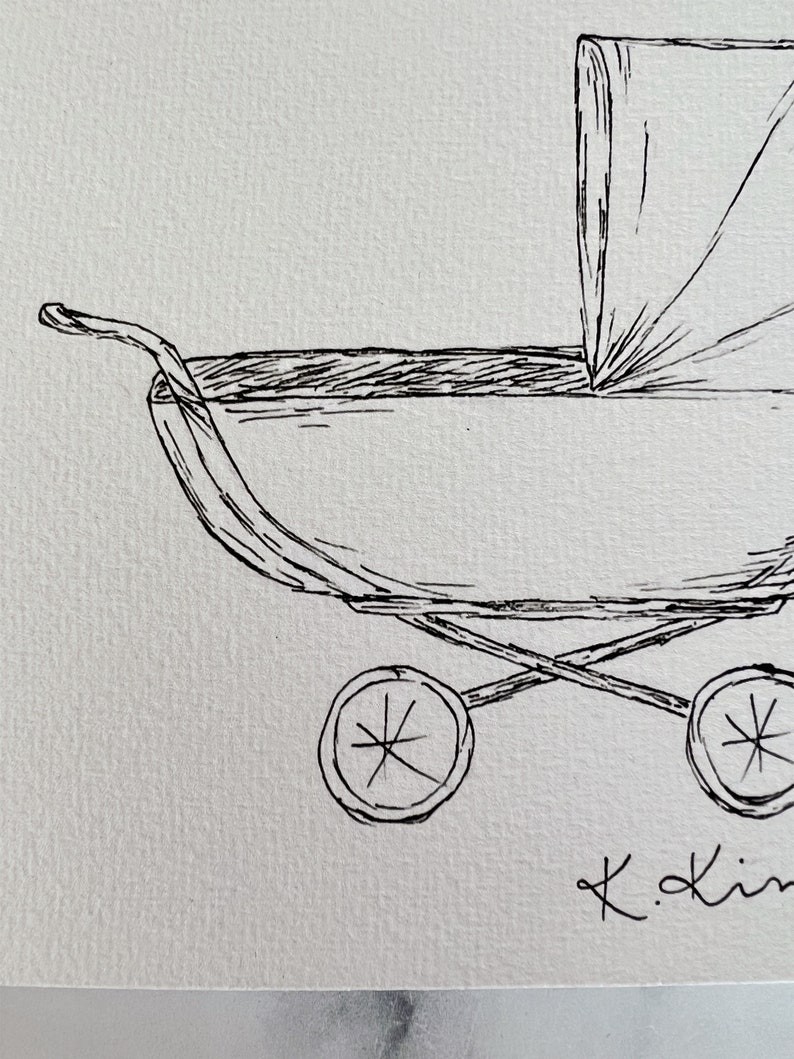 May include: A black and white line drawing of a baby stroller with a canopy. The stroller has four wheels and a handle. The drawing is signed "K.Kim".
