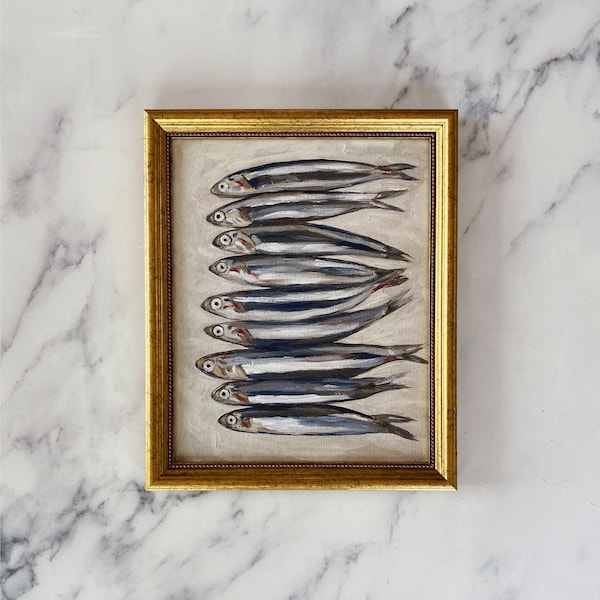 May include: A framed painting of a row of silver fish on a white background. The frame is gold and has a decorative border.