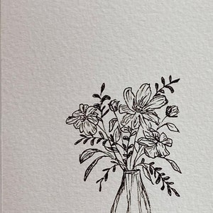 May include: A black and white line drawing of a bouquet of flowers in a vase. The flowers are simple and stylized, with delicate stems and leaves.