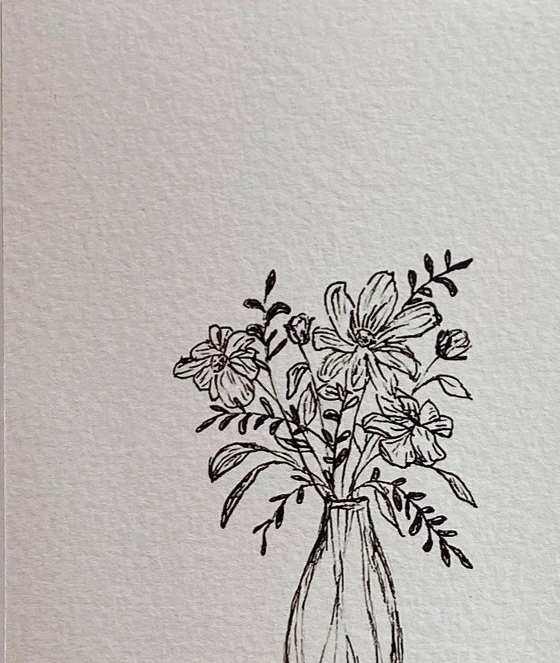 May include: A black and white line drawing of a bouquet of flowers in a vase. The flowers are simple and stylized, with delicate stems and leaves.
