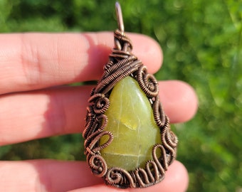 Wire wrapped green serpentine pendant