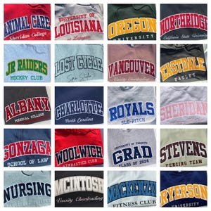 May include: A collection of twenty hooded sweatshirts and crewneck jumpers in various colours, each featuring arched collegiate-style lettering and specific university, club, or team names printed across the chest in bold, contrasting fonts.
