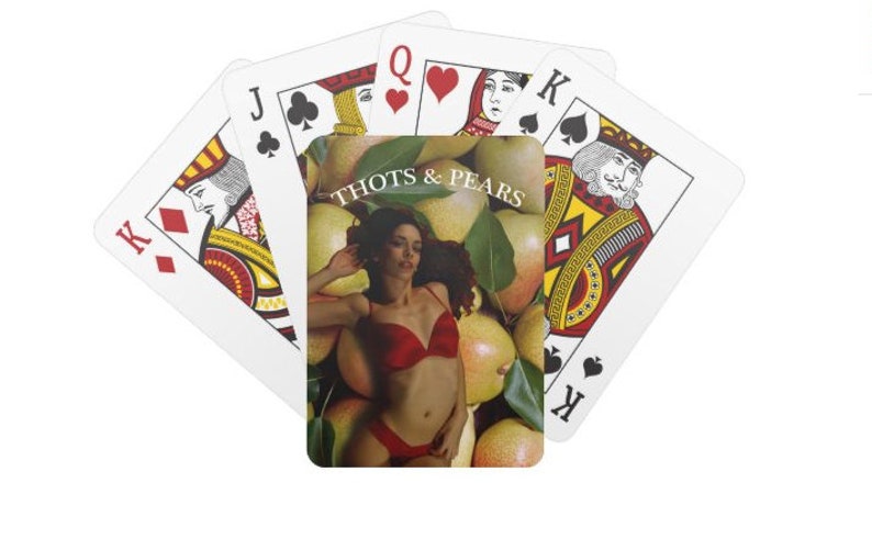 May include: A playing card with a woman in a red bikini lying on a bed of pears. The card is labeled "Thots & Pears".