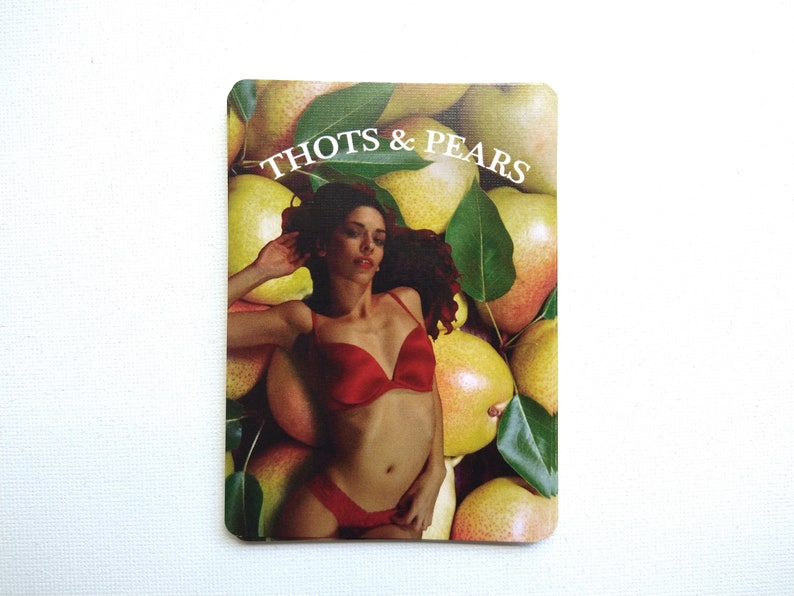 May include: A woman in a red bikini lays on a bed of yellow pears with green leaves. The text "THOTS & PEARS" is printed at the top of the image.