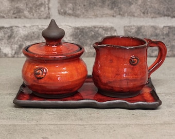 Orange Glaze Pottery Sugar and Creamer Set on Tray