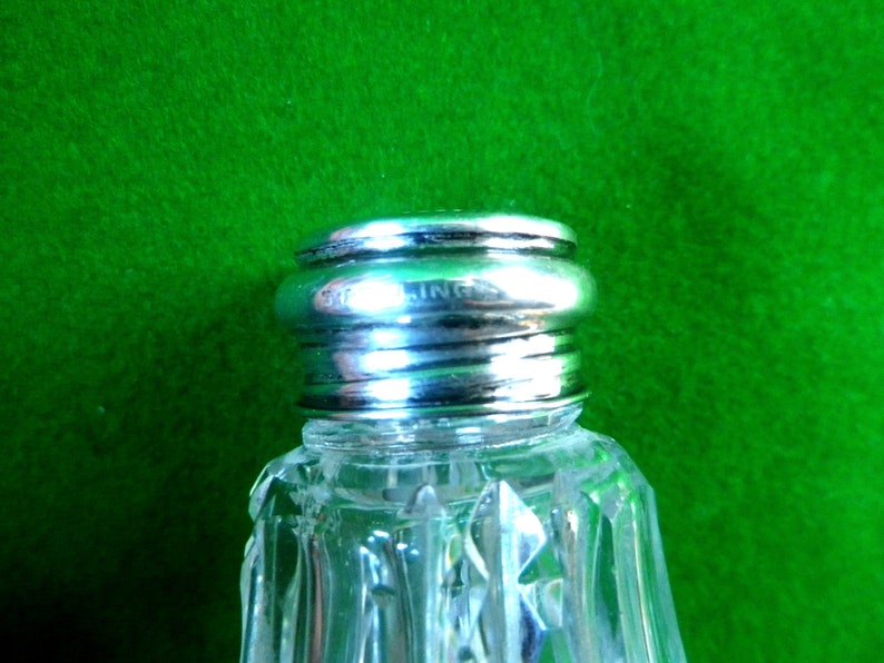 2 mother of pearl and silver top salt and pepper pots with glass bases