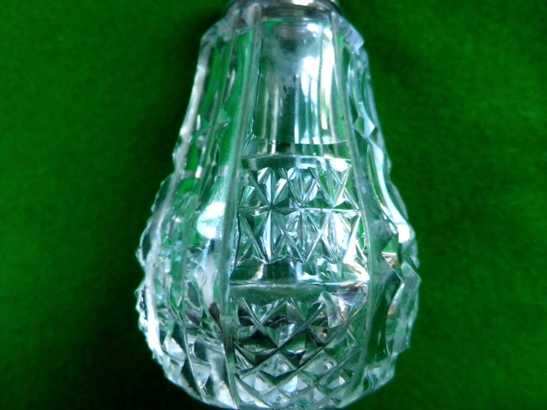 2 mother of pearl and silver top salt and pepper pots with glass bases