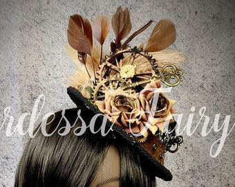 Steampunk inspired mini top hat.  Steampunk small top hat. Brown, black and cream feather hat.