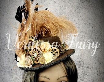 Steampunk inspired mini top hat.  Steampunk small top hat. Brown, black and cream feather hat.