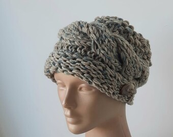 Women's knitted hats. Knitted hat woman. Winter fashionable hat with a button. Soft color. Chunky cozy hat