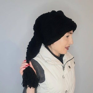 Black winter knitted hat for women, Warm long stocking. A warm winter hat. Stocking cap with a brush. Cap cap