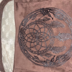 Beautiful suede, hand burned tote with magnetic clasp.