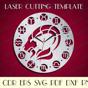 May include: A silver laser cut clock face with the zodiac signs and a goat head in the centre. The clock face is on a red background.  LASER CUTTING TEMPLATE, AI CDR EPS SVG PDF DXF PNG.