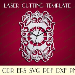 May include: A laser-cut clock template with a decorative, ornate design. The clock face is circular with Roman numerals, and the hands are black. The frame is rectangular with scrolling details. The text "LASER CUTTING TEMPLATE" is at the top.